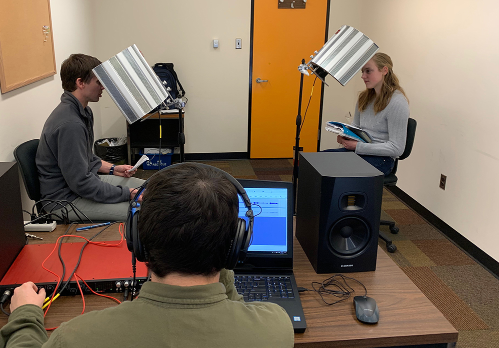 Students recording a podcast