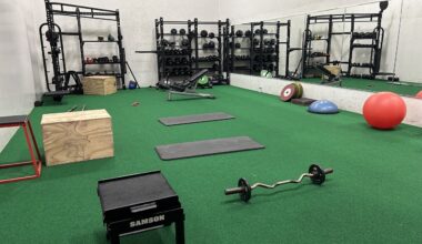 Free weight workout area in the REC featuring turf