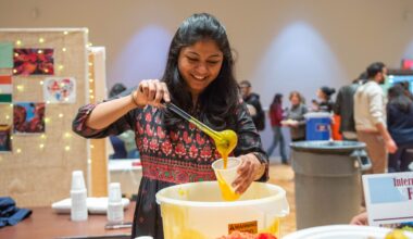 Indian student serving food at the International Food Fest.