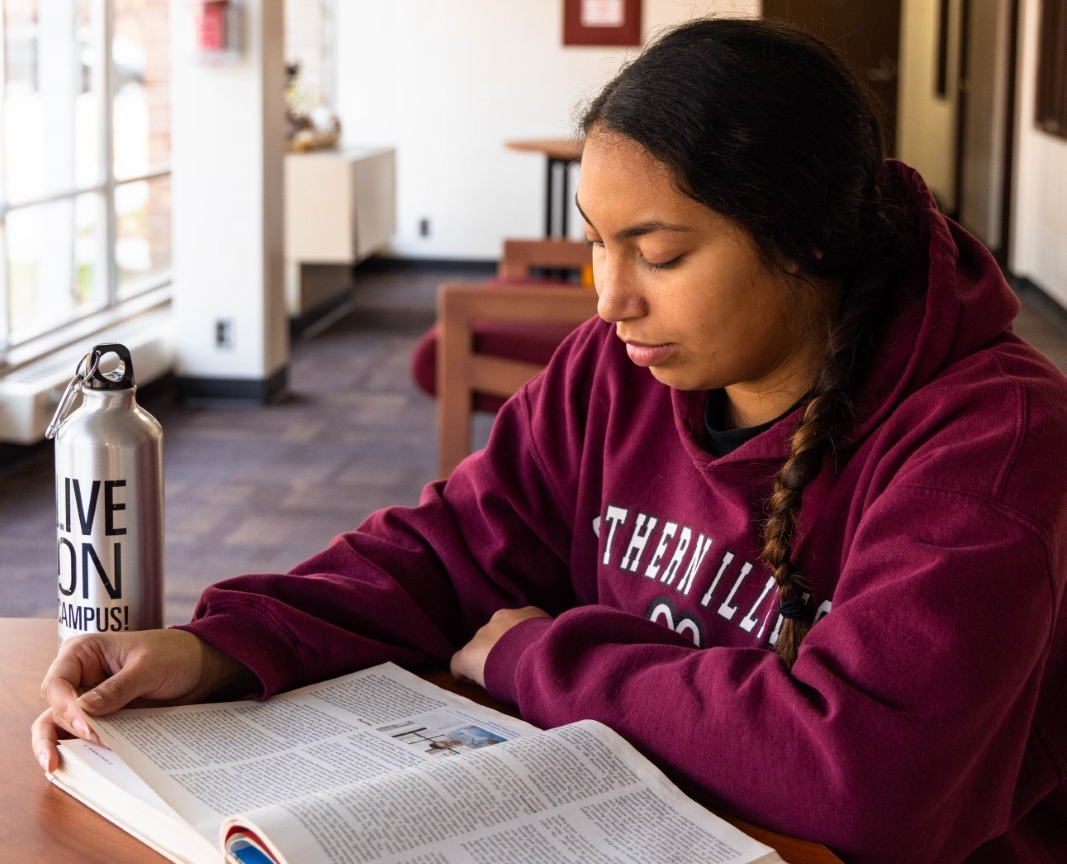 student studying on west campus