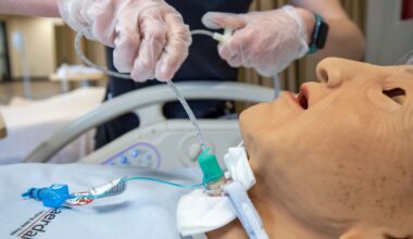 nursing student practicing on a doll