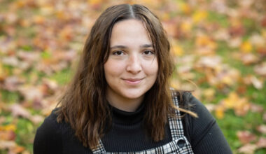 A young woman wearing a black shirt.