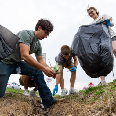 students planting trees for volunteer work