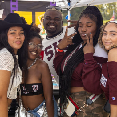students having fun on campus wearing SIU gear