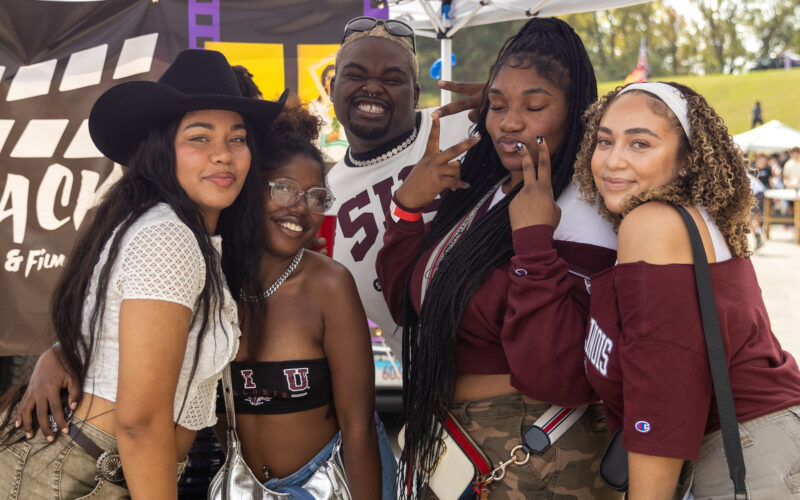 students having fun on campus wearing SIU gear