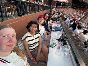 author and friends at a baseball game