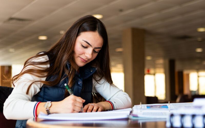 student studying in the library