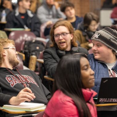 students talking to each other in class