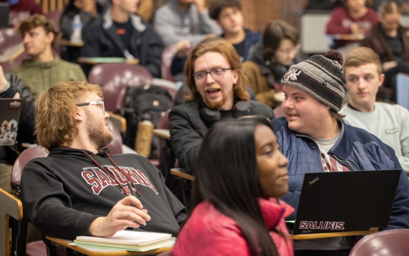 students talking to each other in class