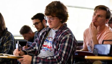 student taking notes in class