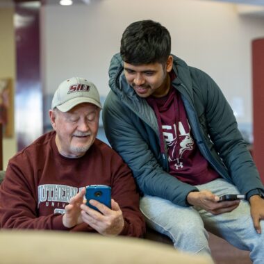 people looking at a phone