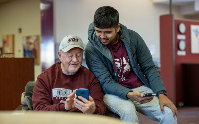 people looking at a phone