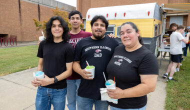 student with their family on campus