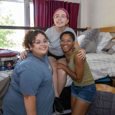 roomates in their room on move in day