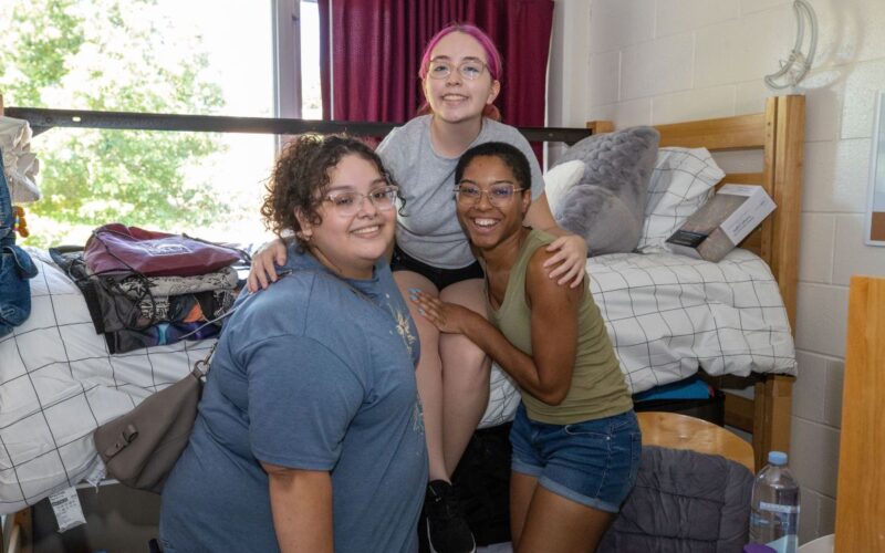 roomates in their room on move in day