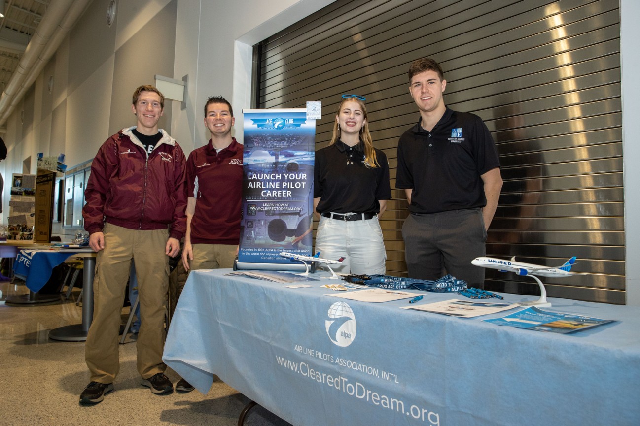 aviation RSO fair students standing by a table