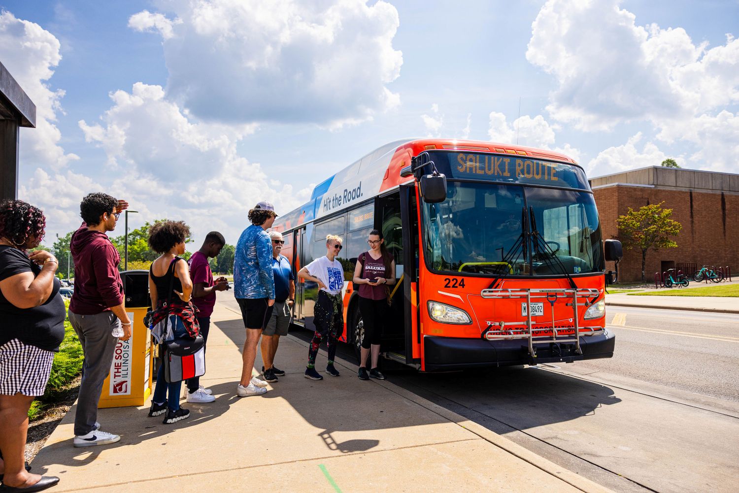 students getting on a bus
