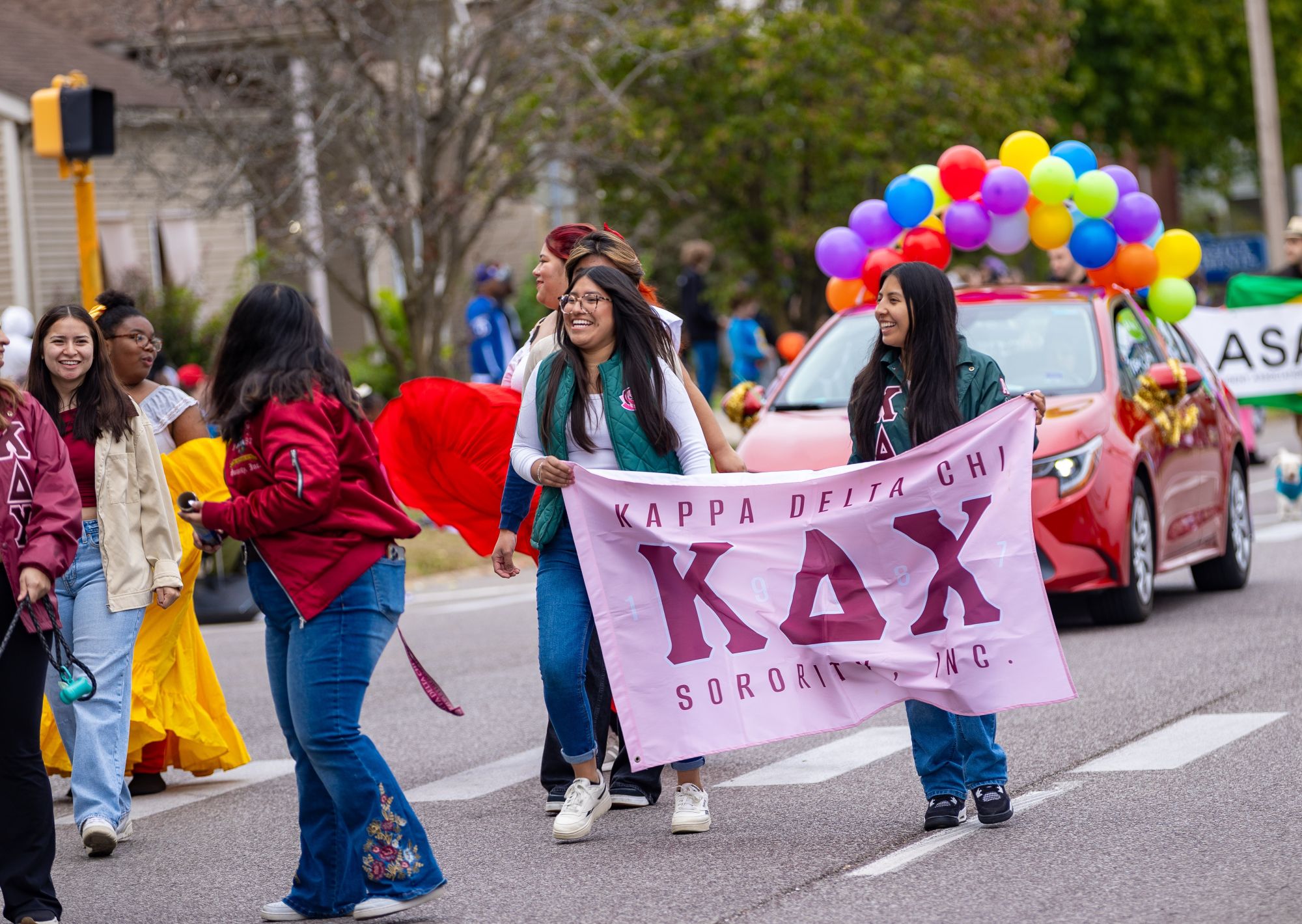 sorority walking in the homecoming parade
